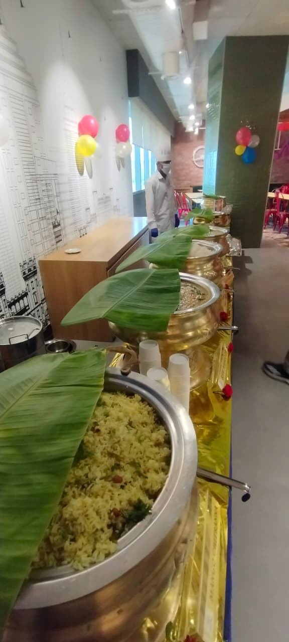 Hospitality staff plating food for guests